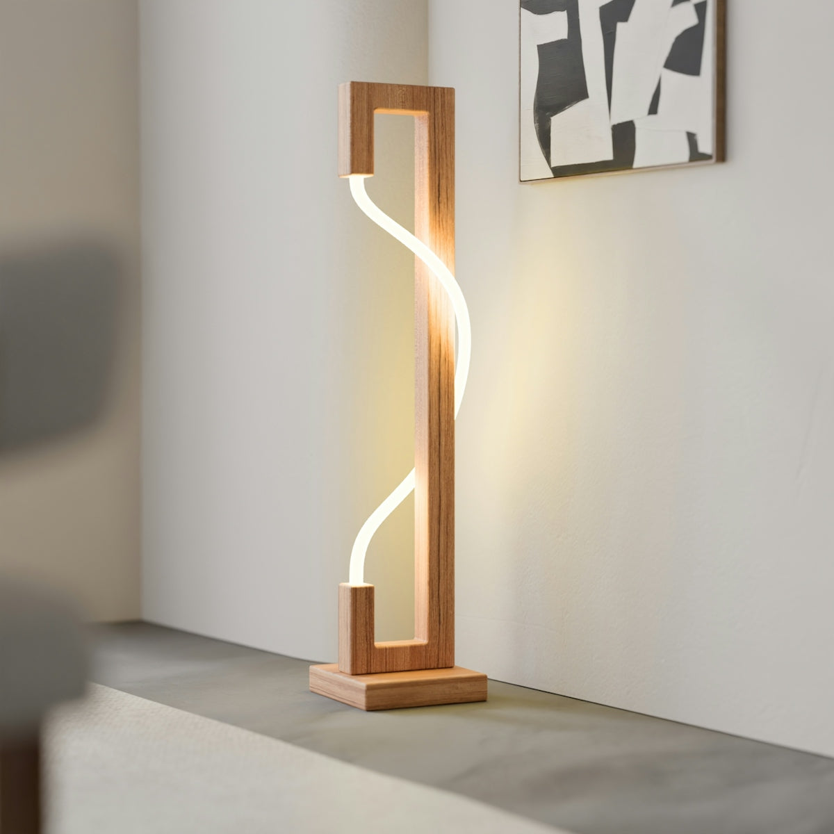 A modern wooden lamp with a glowing wavy light strip